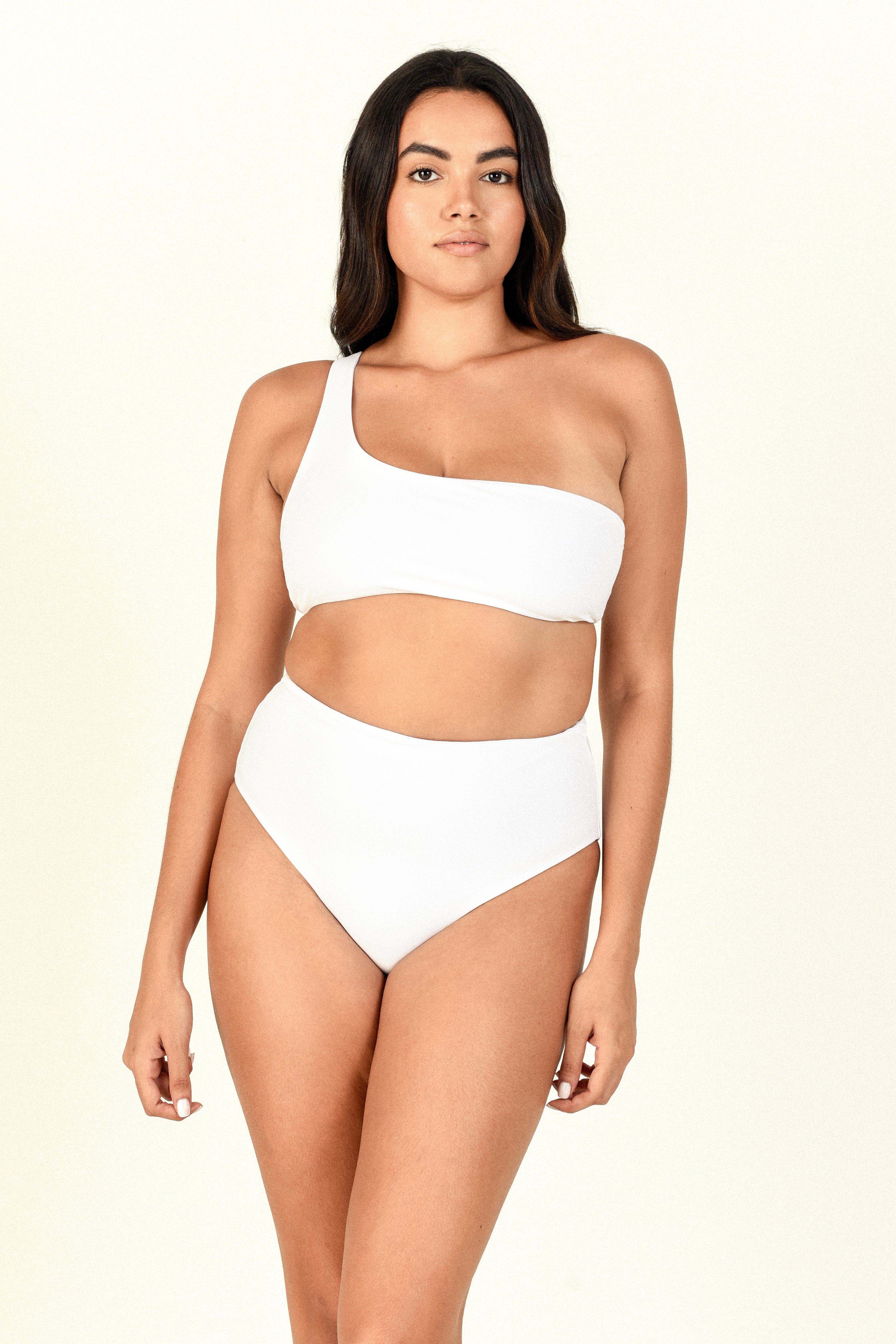 Model against white background showing the Apex Top and Bound Bottom in White