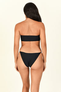 Model standing backwards showing the back of the All Around Bandeau in black