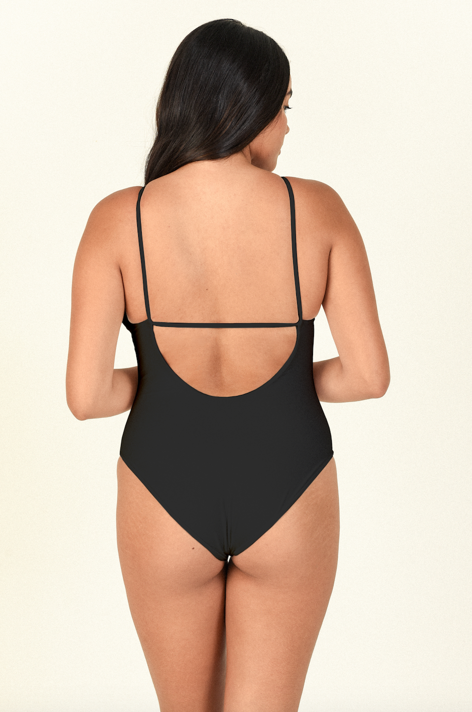 Load image into Gallery viewer, Model standing to the back  wearing the Nova One Piece in Black