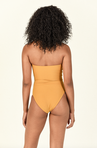 Model showing the back of the Yara One Piece in Golden