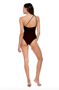 Model standing showing the back of the Apex One Piece in black
