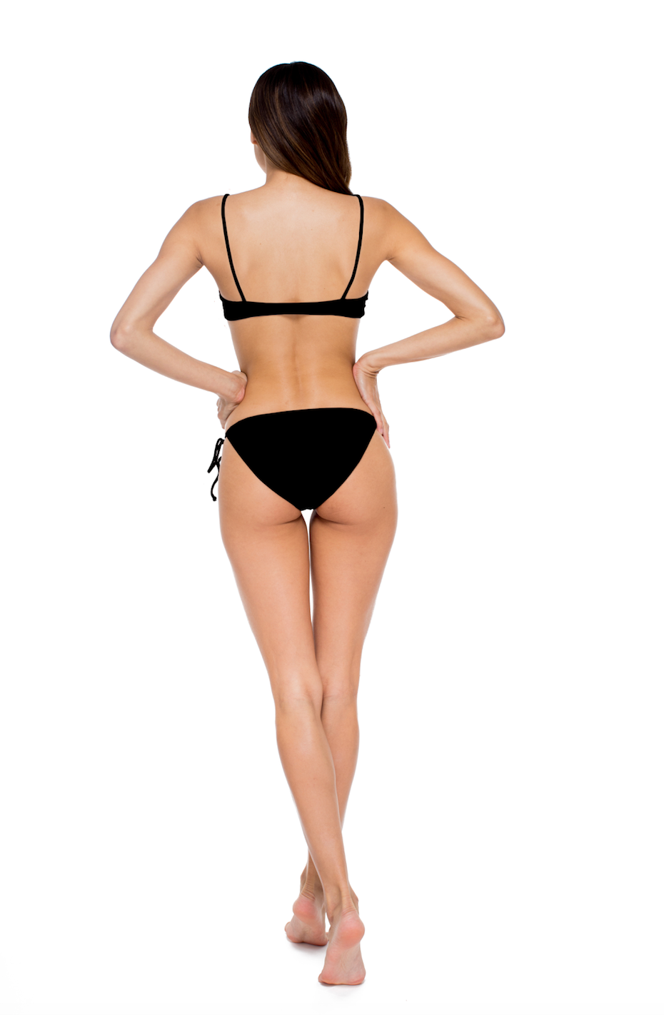 Load image into Gallery viewer, Model standing to the back wearing the Muse Scoop Top and Ties Bottom in Black
