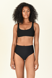 Model against white background wearing the Rounded Edges Top and Bound Bottom in Black